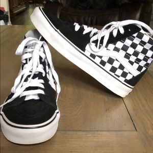 Black and white checkered skate high vans.